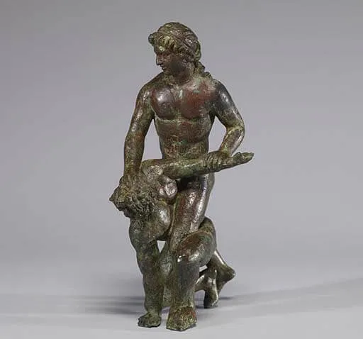 Ancient Greek sculpture of a wrestler applying an armlock on another wrestler.